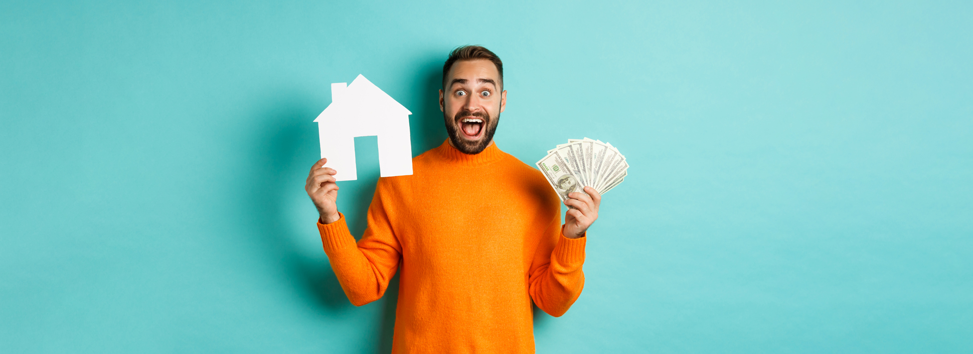Real estate concept and mortgage concept. Excited man showing dollars and paper maket of house, buying flat, standing over blue background.